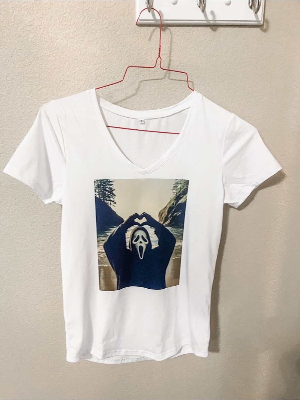 White V-Neck Graphic Tee with Scenic Scream Print